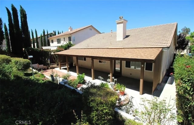 rear view of house featuring a patio area