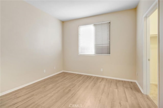 unfurnished room with light hardwood / wood-style floors