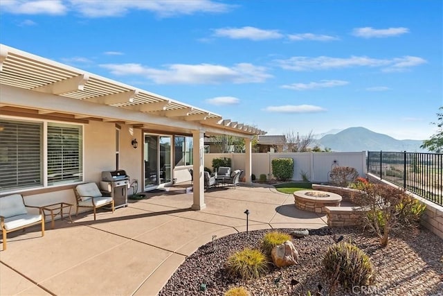 view of patio / terrace with a mountain view, an outdoor fire pit, a grill, and a pergola