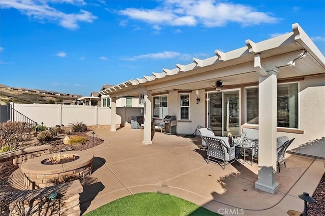 view of patio / terrace featuring ceiling fan, an outdoor fire pit, and grilling area