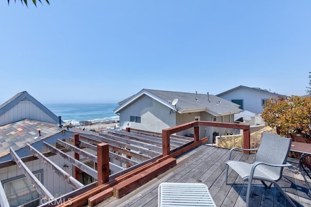 wooden deck with a water view