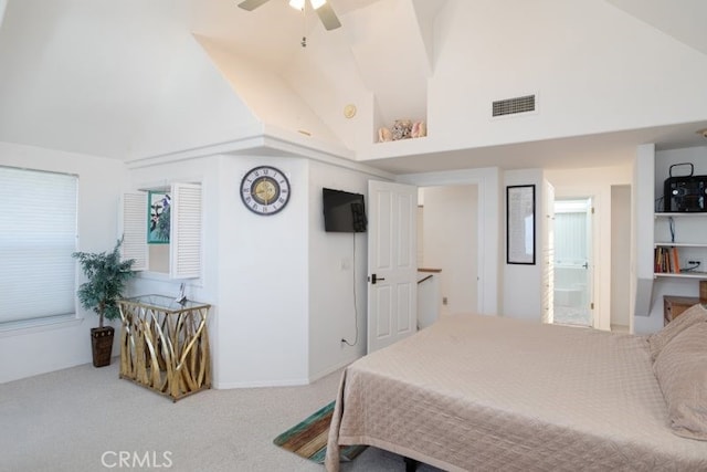 carpeted bedroom with high vaulted ceiling and visible vents