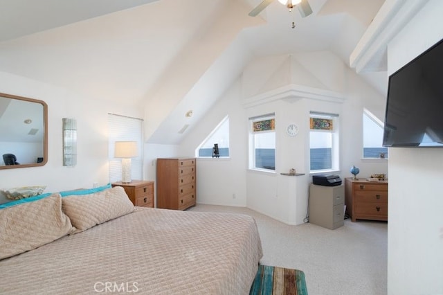 carpeted bedroom featuring vaulted ceiling, multiple windows, and a ceiling fan