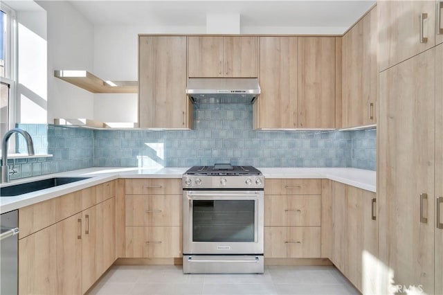 kitchen with light brown cabinetry, sink, tasteful backsplash, and stainless steel appliances