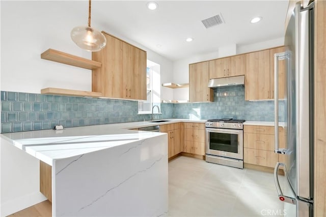 kitchen with stainless steel appliances, light brown cabinets, light stone counters, and decorative light fixtures