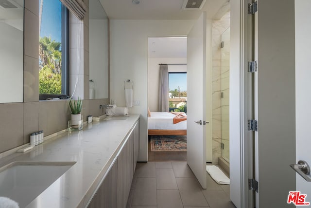 bathroom with vanity and tile patterned floors