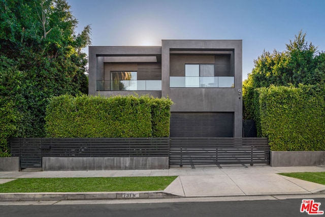 contemporary house with a balcony and a garage