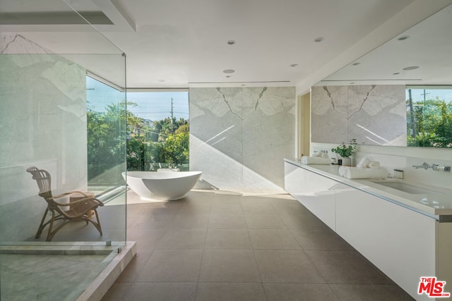 bathroom featuring a bath and vanity