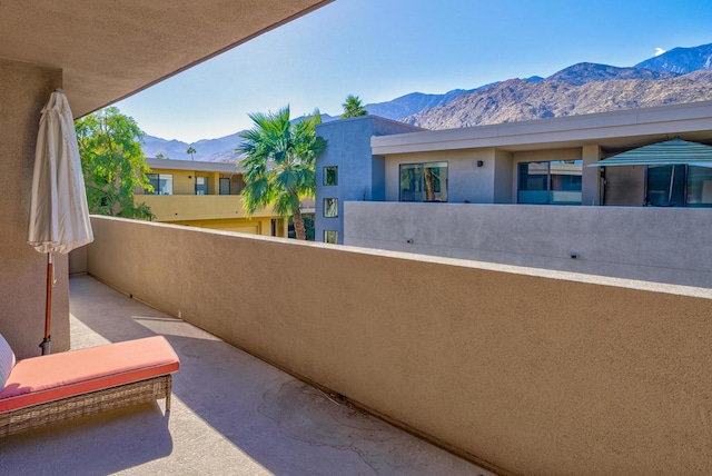 balcony featuring a mountain view