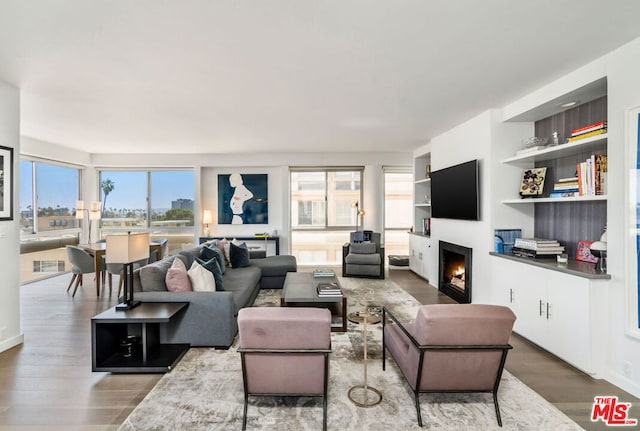 living room featuring a wealth of natural light and hardwood / wood-style floors