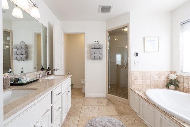 full bathroom featuring tile patterned flooring, vanity, toilet, and plus walk in shower