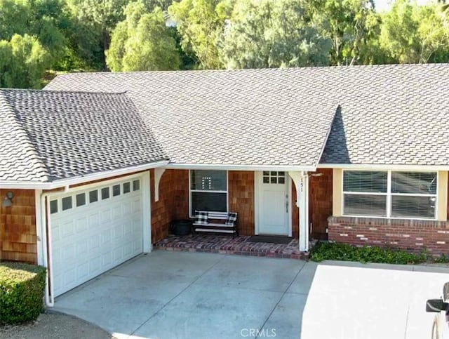 ranch-style house featuring a garage