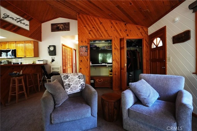 living room with vaulted ceiling, wooden ceiling, dark carpet, and wood walls