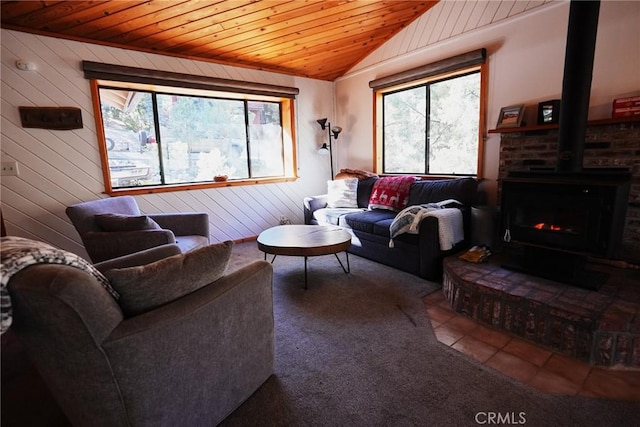 living room featuring wooden ceiling, wood walls, and a healthy amount of sunlight