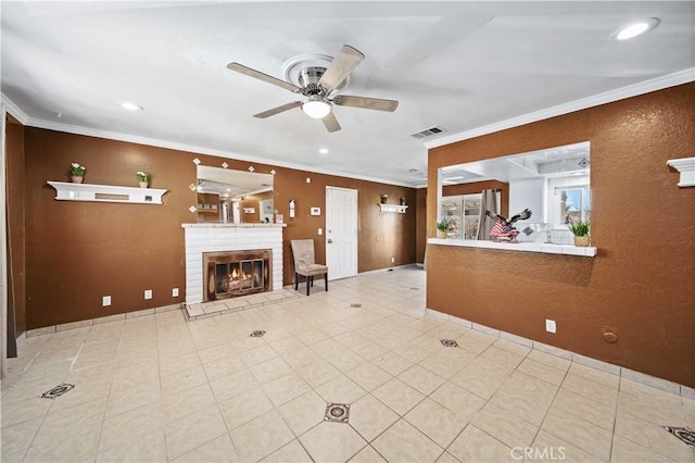 unfurnished living room featuring a fireplace, ceiling fan, and ornamental molding