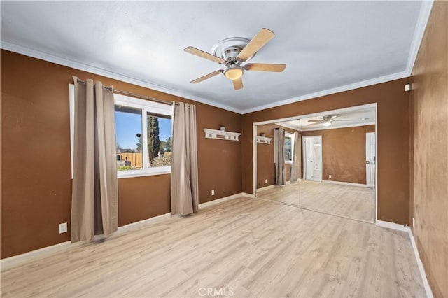 spare room with ceiling fan, light hardwood / wood-style flooring, and ornamental molding