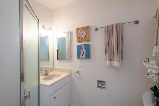 bathroom with vanity and toilet