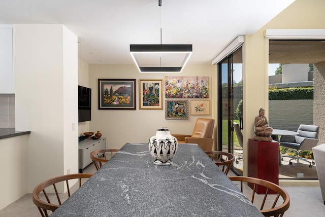 dining area with a wall of windows