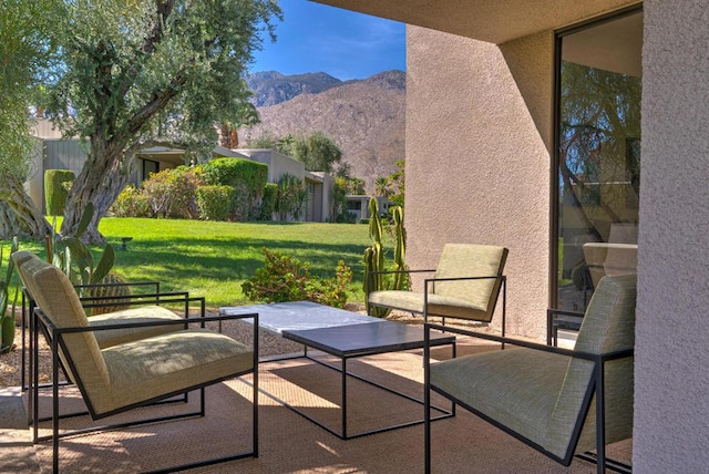 view of patio / terrace with a mountain view