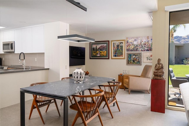 dining area featuring sink