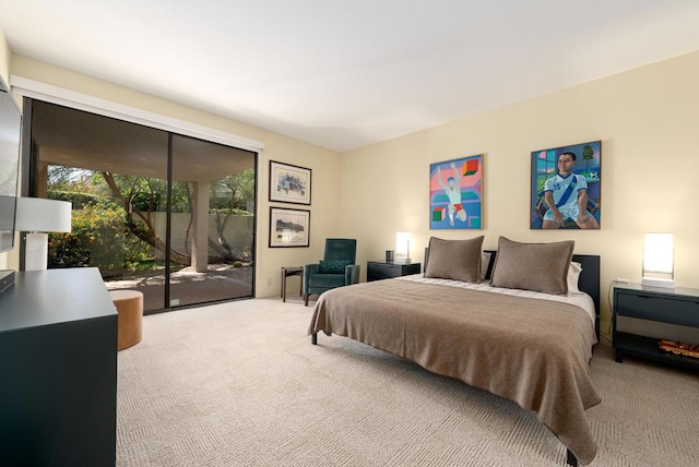 bedroom featuring carpet flooring and access to exterior