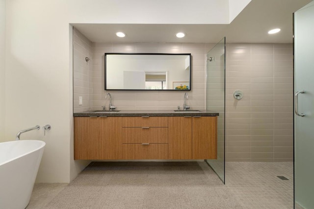 bathroom with tasteful backsplash, vanity, and plus walk in shower