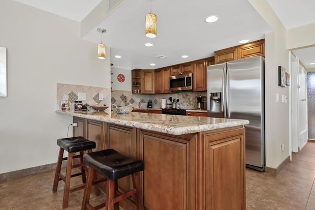 kitchen with pendant lighting, stainless steel appliances, light stone counters, tasteful backsplash, and kitchen peninsula