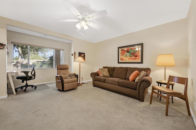 living room with ceiling fan and light carpet