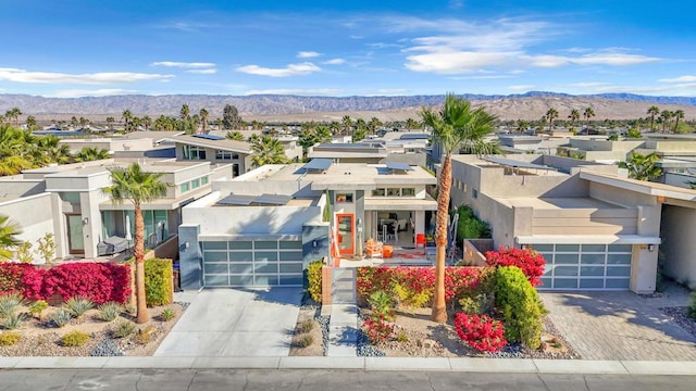 exterior space with a mountain view and a garage