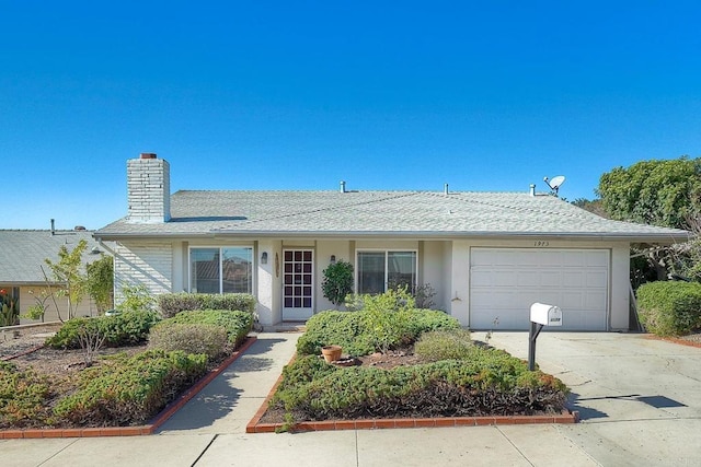 ranch-style house featuring stucco siding, a garage, concrete driveway, and a chimney