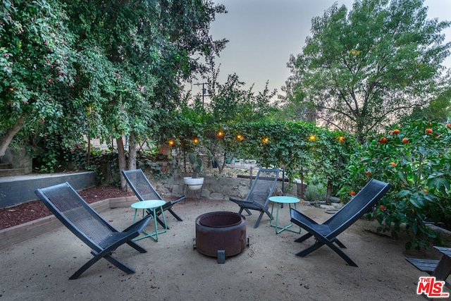 view of patio with a fire pit