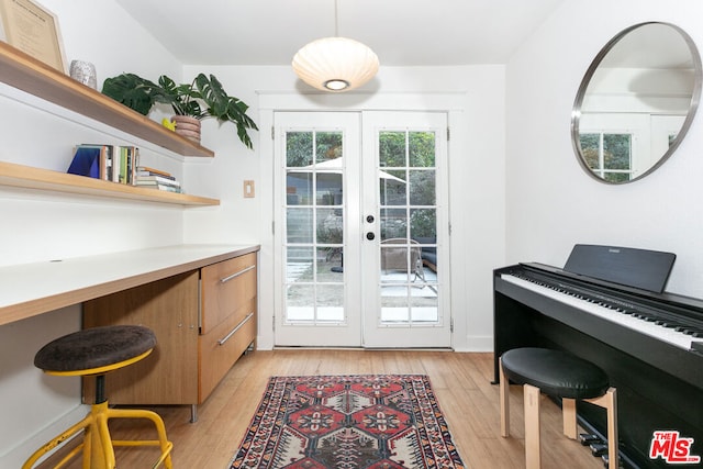 entryway with french doors and light hardwood / wood-style floors