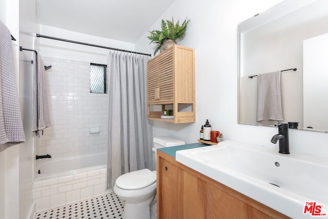 full bathroom featuring vanity, toilet, and shower / bathtub combination with curtain