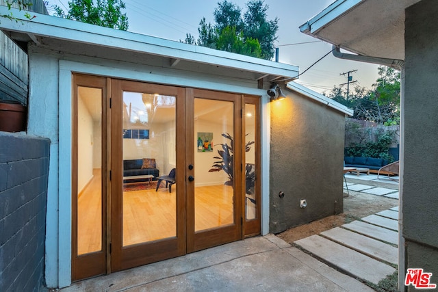 property entrance with french doors and a patio