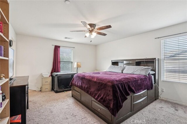 bedroom featuring carpet, visible vents, ceiling fan, and baseboards