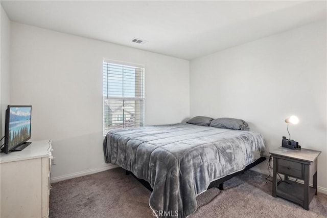 bedroom with baseboards, visible vents, and carpet flooring