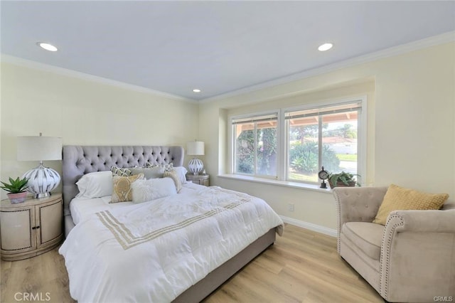 bedroom featuring light wood-type flooring and ornamental molding