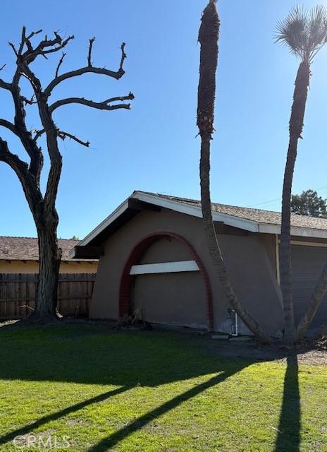 view of home's exterior with a yard