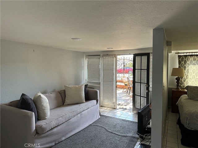 living room with light tile patterned floors and a textured ceiling