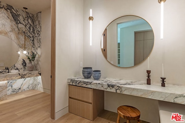 bathroom with vanity and hardwood / wood-style flooring