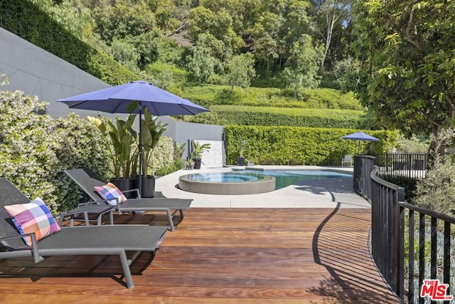 wooden deck with a pool with hot tub