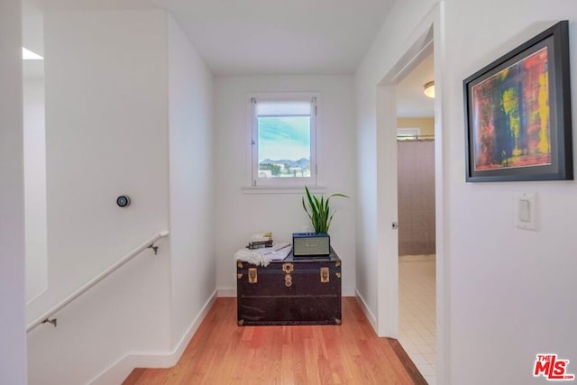 hall with light hardwood / wood-style floors