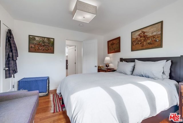 bedroom with light wood-type flooring