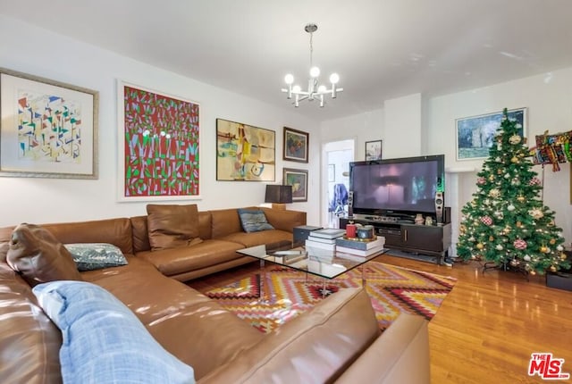 living room featuring hardwood / wood-style floors and a notable chandelier