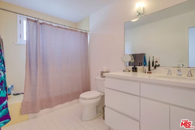 full bathroom featuring tile patterned floors, vanity, shower / bathtub combination with curtain, and toilet