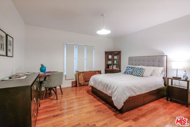 bedroom with light wood-type flooring