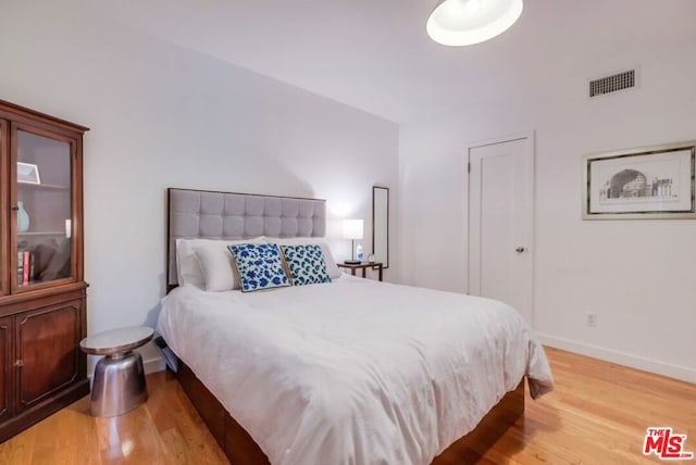 bedroom featuring light hardwood / wood-style floors