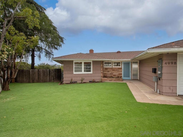 exterior space with a yard and a patio area