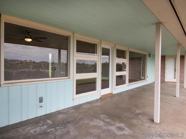 view of patio featuring ceiling fan