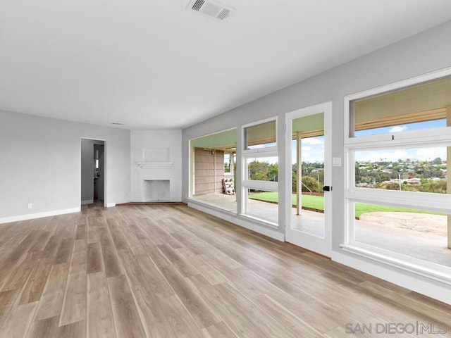 unfurnished living room with light hardwood / wood-style floors